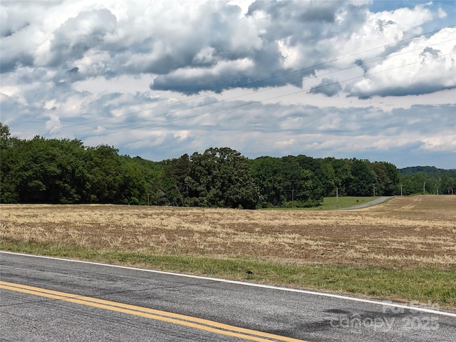 view of road featuring a view of trees