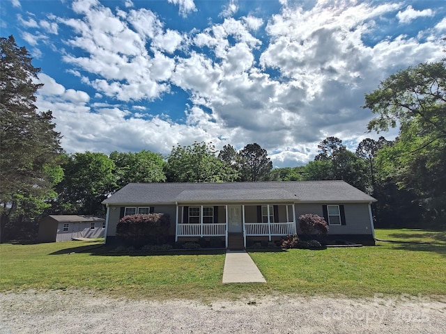 single story home featuring a porch and a front lawn