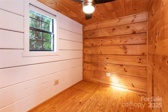 214 Pike Pt, Waynesville, NC 28785 - unfurnished room featuring wood walls, light wood-style flooring, ceiling fan, and wooden ceiling