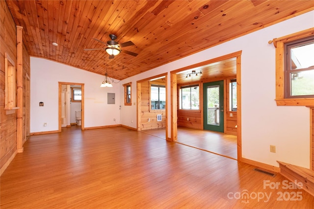 214 Pike Pt, Waynesville, NC 28785 - interior space with light wood finished floors, ceiling fan, lofted ceiling, and a healthy amount of sunlight