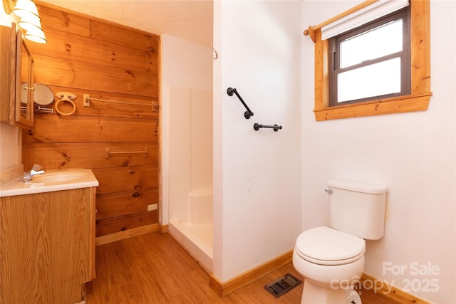 214 Pike Pt, Waynesville, NC 28785 - bathroom featuring vanity, baseboards, a shower stall, wood finished floors, and visible vents