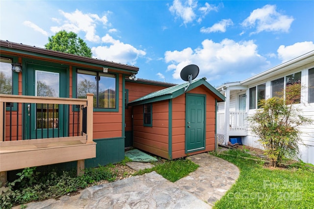 214 Pike Pt, Waynesville, NC 28785 - back of house featuring a storage shed and an outdoor structure