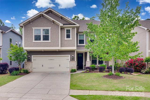 craftsman-style home featuring brick siding, driveway, a front yard, and a garage