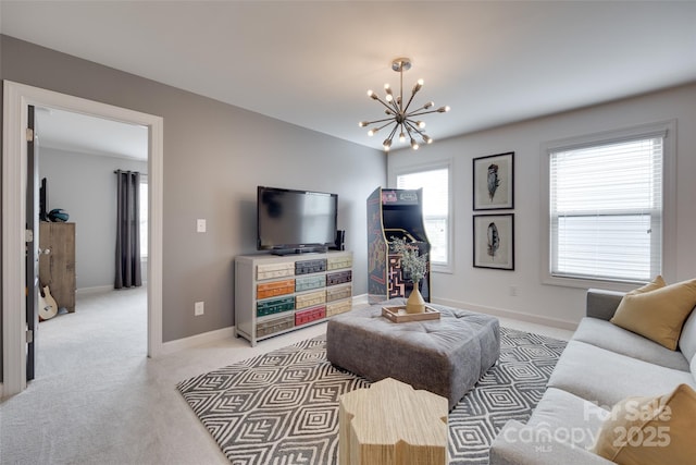 living room featuring baseboards, light colored carpet, and a chandelier
