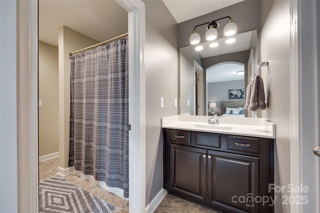 bathroom with vanity, tile patterned flooring, and a shower with curtain