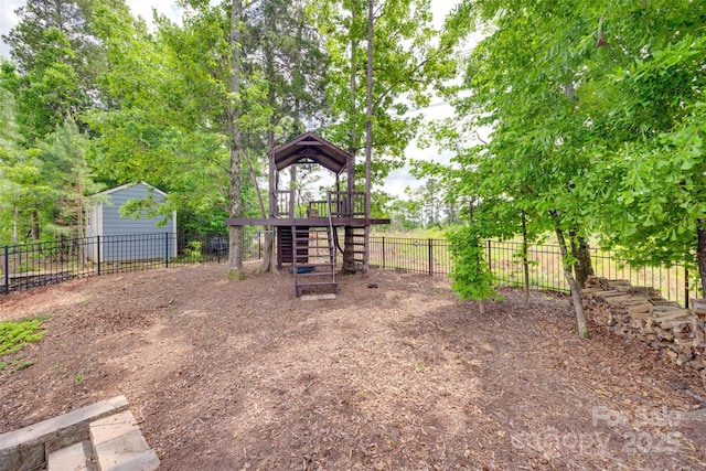 view of playground featuring fence