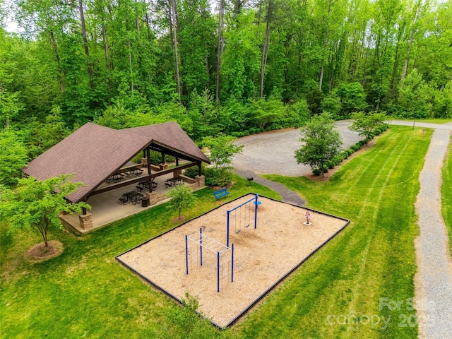 view of community featuring a yard, a gazebo, and driveway