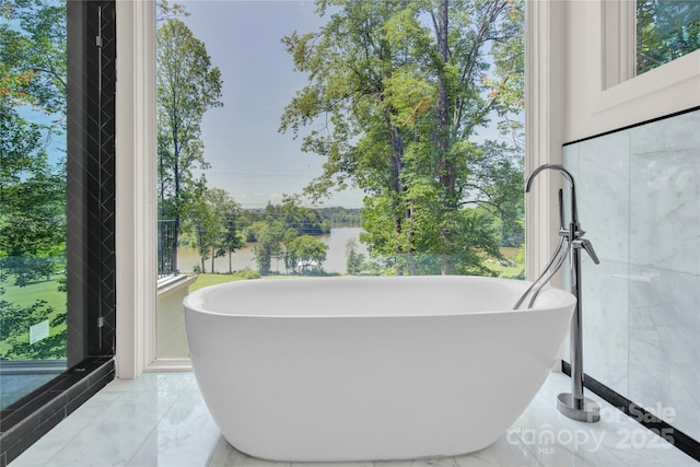 124 Clipper Ln, Mooresville, NC 28117 - full bathroom with a freestanding tub, marble tiled floors, and plenty of natural light