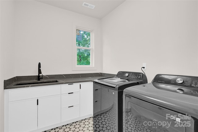 124 Clipper Ln, Mooresville, NC 28117 - laundry area featuring washer and clothes dryer, light floors, and cabinet space