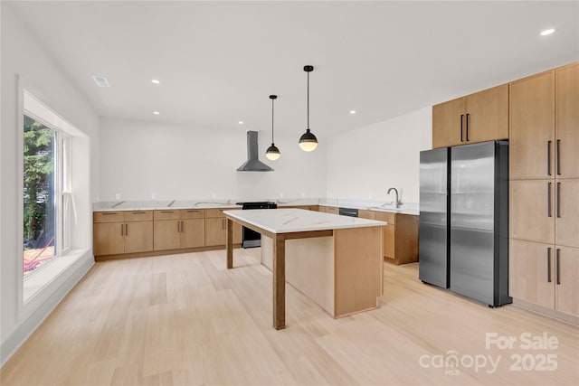 124 Clipper Ln, Mooresville, NC 28117 - kitchen with freestanding refrigerator, wall chimney exhaust hood, a sink, light wood finished floors, and electric range oven