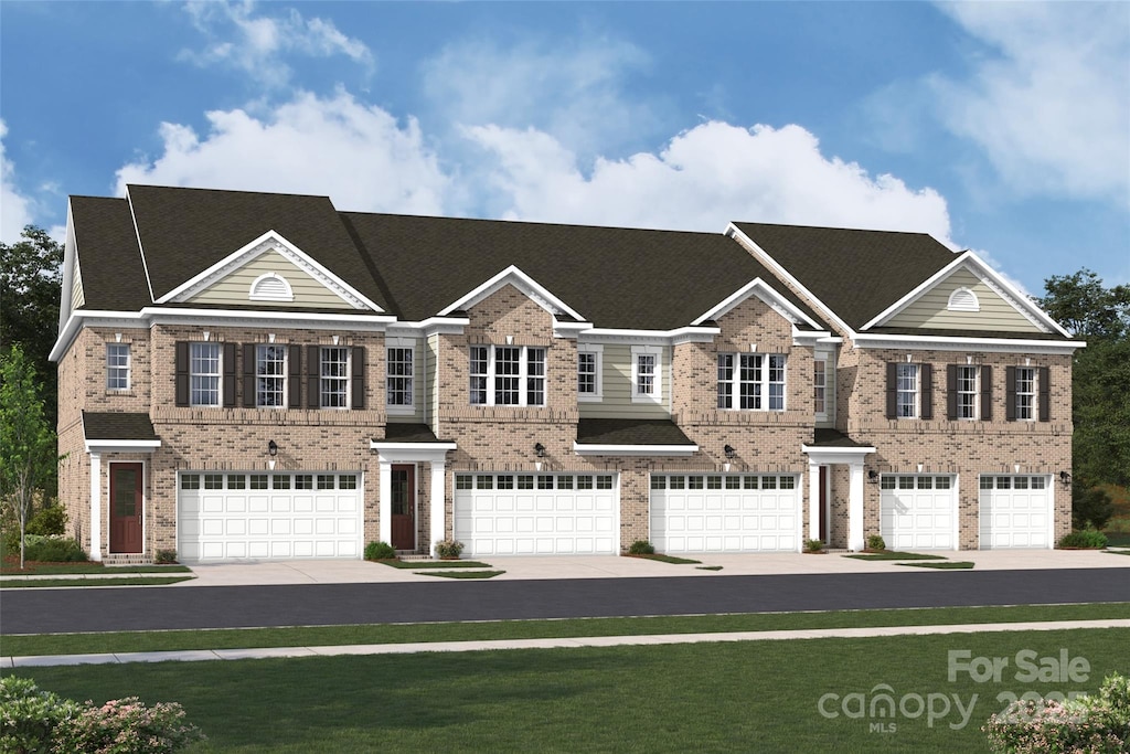 view of front of property with brick siding and driveway