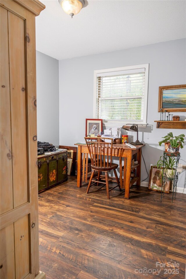 dining area with wood finished floors