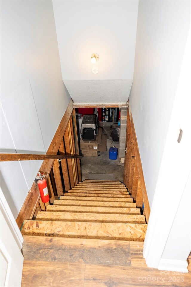 staircase featuring wood finished floors