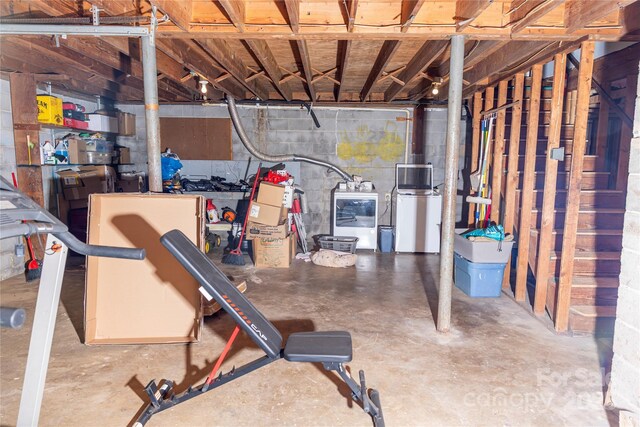 unfinished below grade area with washer / clothes dryer