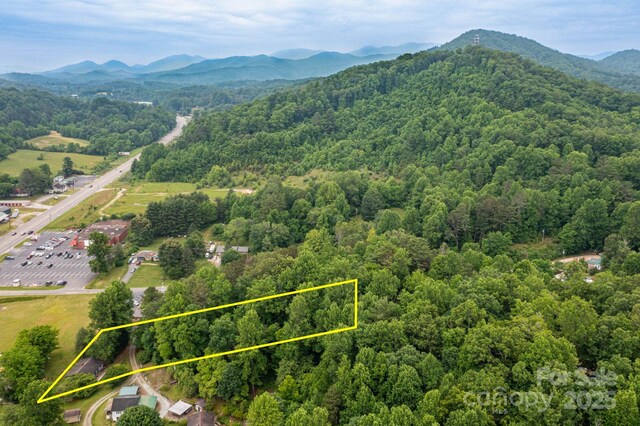 57 Gribble Rd, Franklin, NC 28734 - view of property location featuring a heavily wooded area, a mountain backdrop, and property boundaries highlighted