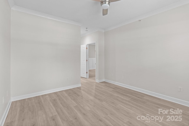 empty room with crown molding, ceiling fan, baseboards, and light wood finished floors