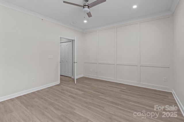 unfurnished bedroom with crown molding, recessed lighting, baseboards, and light wood-type flooring