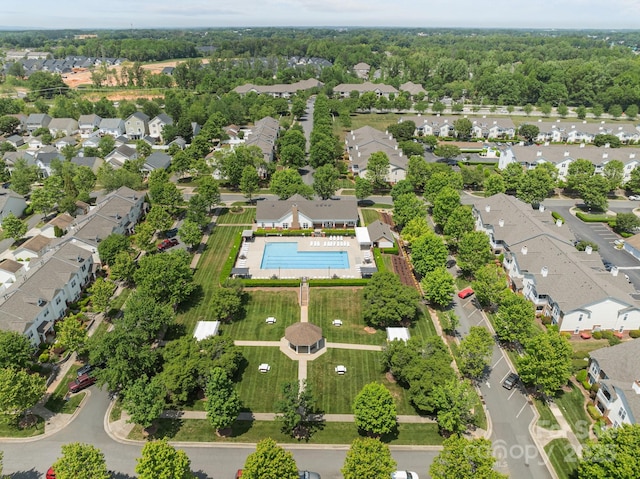 birds eye view of property with a residential view