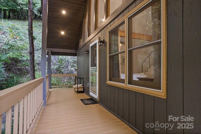 wooden terrace featuring covered porch