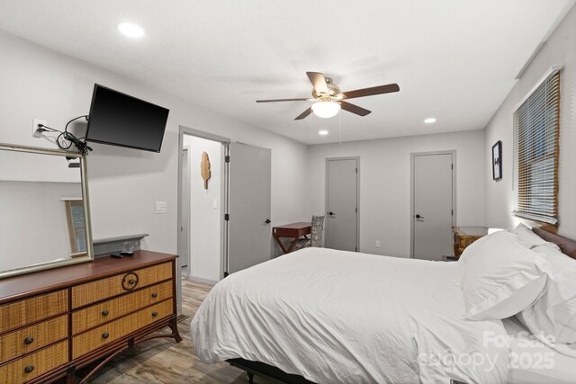 bedroom with recessed lighting, a ceiling fan, and wood finished floors
