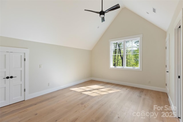 bonus room featuring baseboards, ceiling fan, lofted ceiling, and light wood-type flooring