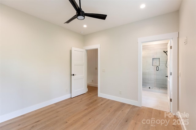 unfurnished bedroom featuring ceiling fan, baseboards, connected bathroom, light wood-style floors, and recessed lighting