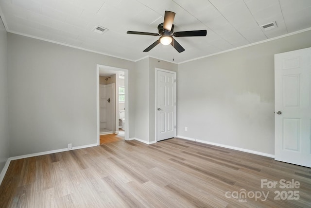 unfurnished bedroom featuring crown molding, baseboards, visible vents, and light wood-style floors