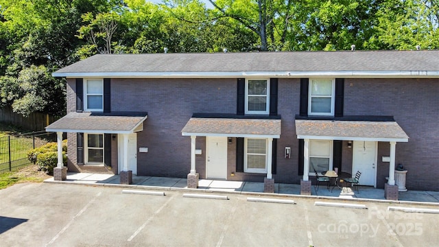 1512 Seigle Ave Unit 2, Charlotte, NC 28205 - view of front of home with uncovered parking, a porch, and brick siding