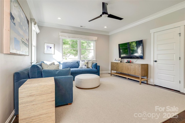 carpeted living room featuring baseboards, a ceiling fan, ornamental molding, and recessed lighting