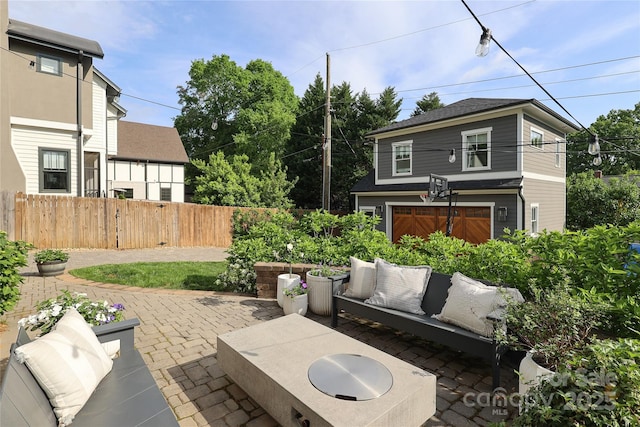 view of patio featuring fence and an outdoor hangout area