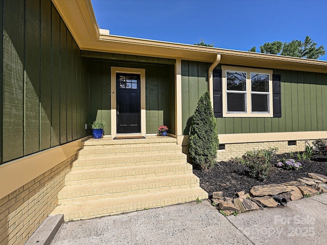 doorway to property featuring crawl space
