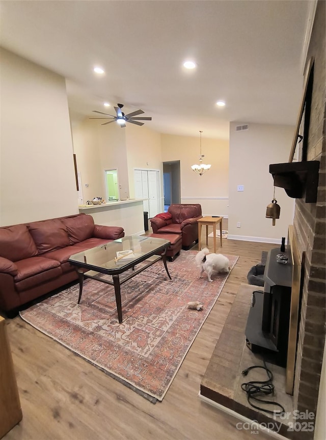5601 Carmel Station Ave, Charlotte, NC 28226 - living room featuring wood finished floors, recessed lighting, ceiling fan, a chandelier, and baseboards