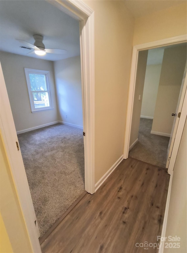 5601 Carmel Station Ave, Charlotte, NC 28226 - hall with baseboards, dark wood-style floors, and dark carpet