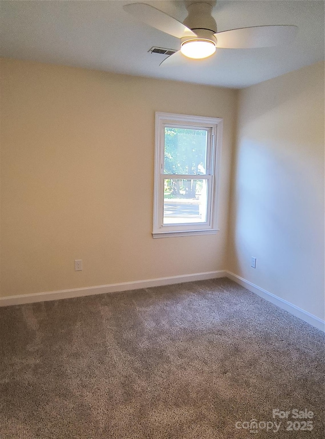 5601 Carmel Station Ave, Charlotte, NC 28226 - spare room with carpet floors, a ceiling fan, and baseboards