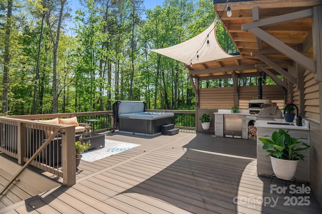 wooden deck featuring a grill, a hot tub, an outdoor hangout area, and area for grilling