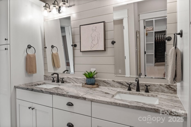 bathroom with double vanity and a sink