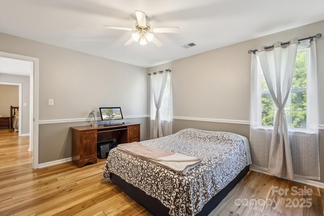 3223 Rheinwood Ct, Matthews, NC 28105 - bedroom featuring light wood finished floors, ceiling fan, and baseboards