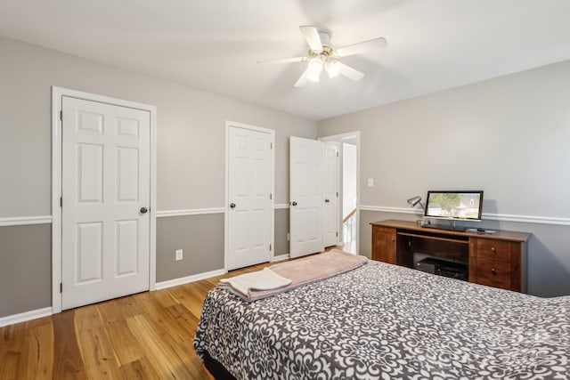 3223 Rheinwood Ct, Matthews, NC 28105 - bedroom with wood finished floors, baseboards, and ceiling fan
