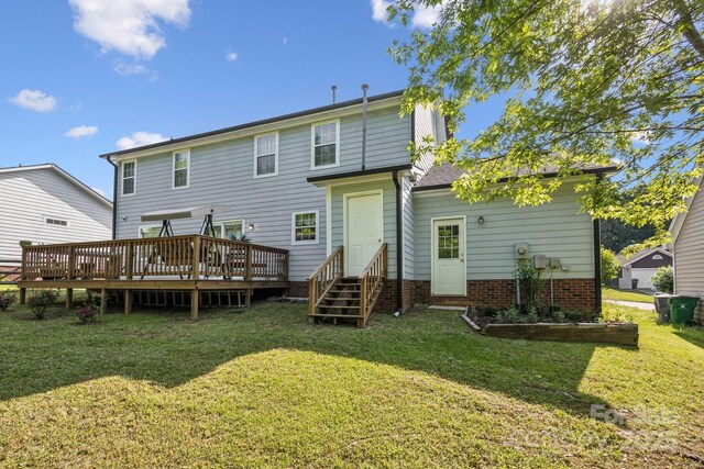 3223 Rheinwood Ct, Matthews, NC 28105 - back of property featuring entry steps, a lawn, and a wooden deck