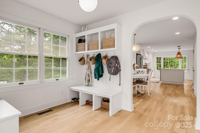 92 Rose Hill Rd, Asheville, NC 28803 - mudroom featuring arched walkways, light wood finished floors, recessed lighting, and baseboards