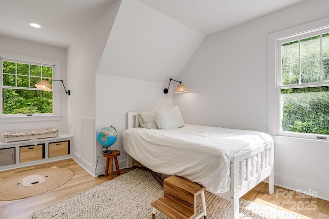 92 Rose Hill Rd, Asheville, NC 28803 - bedroom featuring multiple windows, wood finished floors, recessed lighting, and lofted ceiling