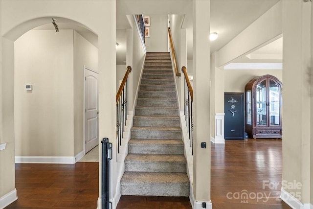 1011 Potomac Rd, Indian Trail, NC 28079 - stairway with wood finished floors, arched walkways, and baseboards