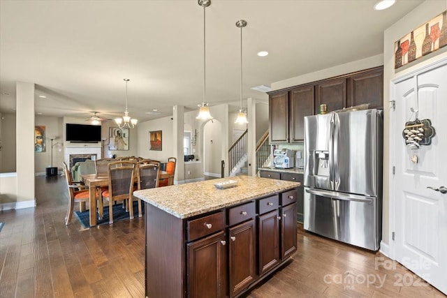 1011 Potomac Rd, Indian Trail, NC 28079 - kitchen featuring stainless steel fridge with ice dispenser, dark wood finished floors, dark brown cabinetry, hanging light fixtures, and ceiling fan