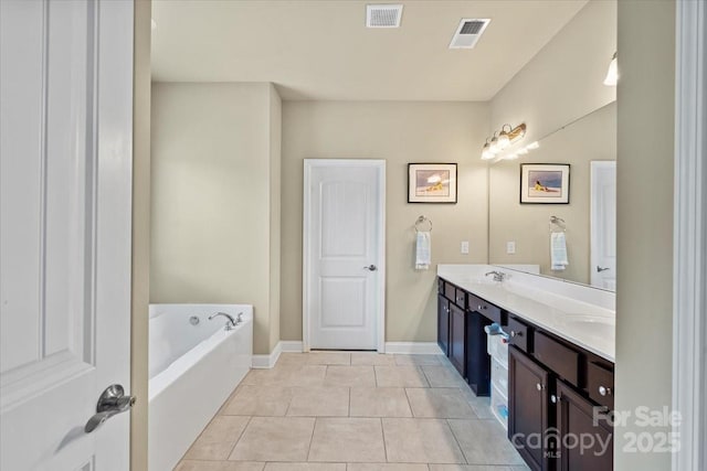 1011 Potomac Rd, Indian Trail, NC 28079 - full bathroom with tile patterned flooring, a bath, double vanity, and baseboards