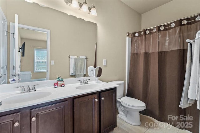 1011 Potomac Rd, Indian Trail, NC 28079 - bathroom with toilet, double vanity, tile patterned flooring, and curtained shower