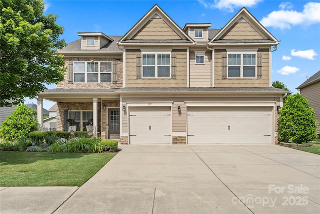 1011 Potomac Rd, Indian Trail, NC 28079 - craftsman house with a garage, a front lawn, driveway, and stone siding