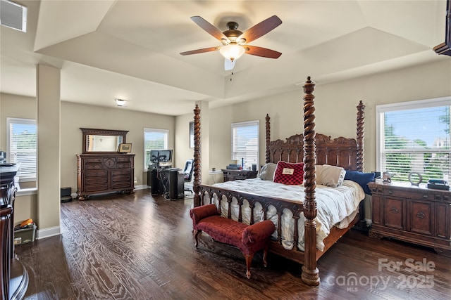 1011 Potomac Rd, Indian Trail, NC 28079 - bedroom featuring wood finished floors, ceiling fan, and a tray ceiling