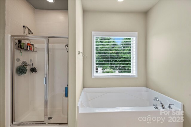 1011 Potomac Rd, Indian Trail, NC 28079 - full bathroom with a shower stall, a garden tub, and recessed lighting
