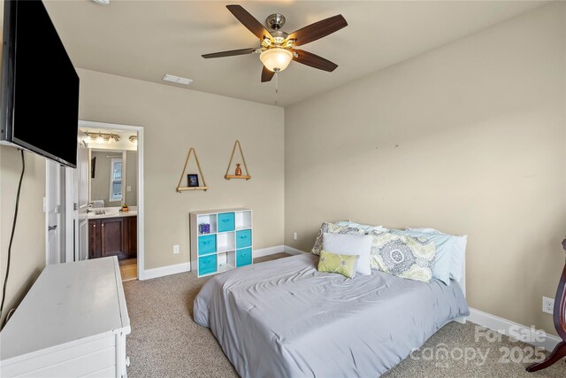 1011 Potomac Rd, Indian Trail, NC 28079 - bedroom featuring light colored carpet, ensuite bath, and ceiling fan