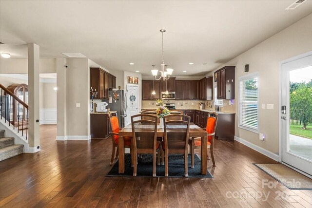 1011 Potomac Rd, Indian Trail, NC 28079 - dining space featuring a chandelier, dark wood-style floors, stairway, and recessed lighting